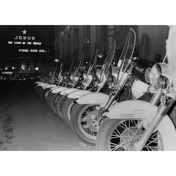 Cop cycles near SW Burnside during Ford's visit to Portland 